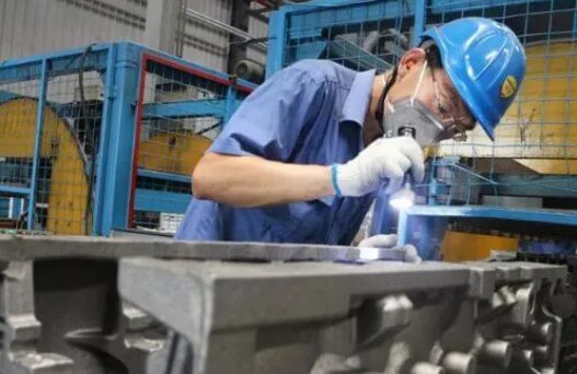 technicians are conducting casting quality control testing